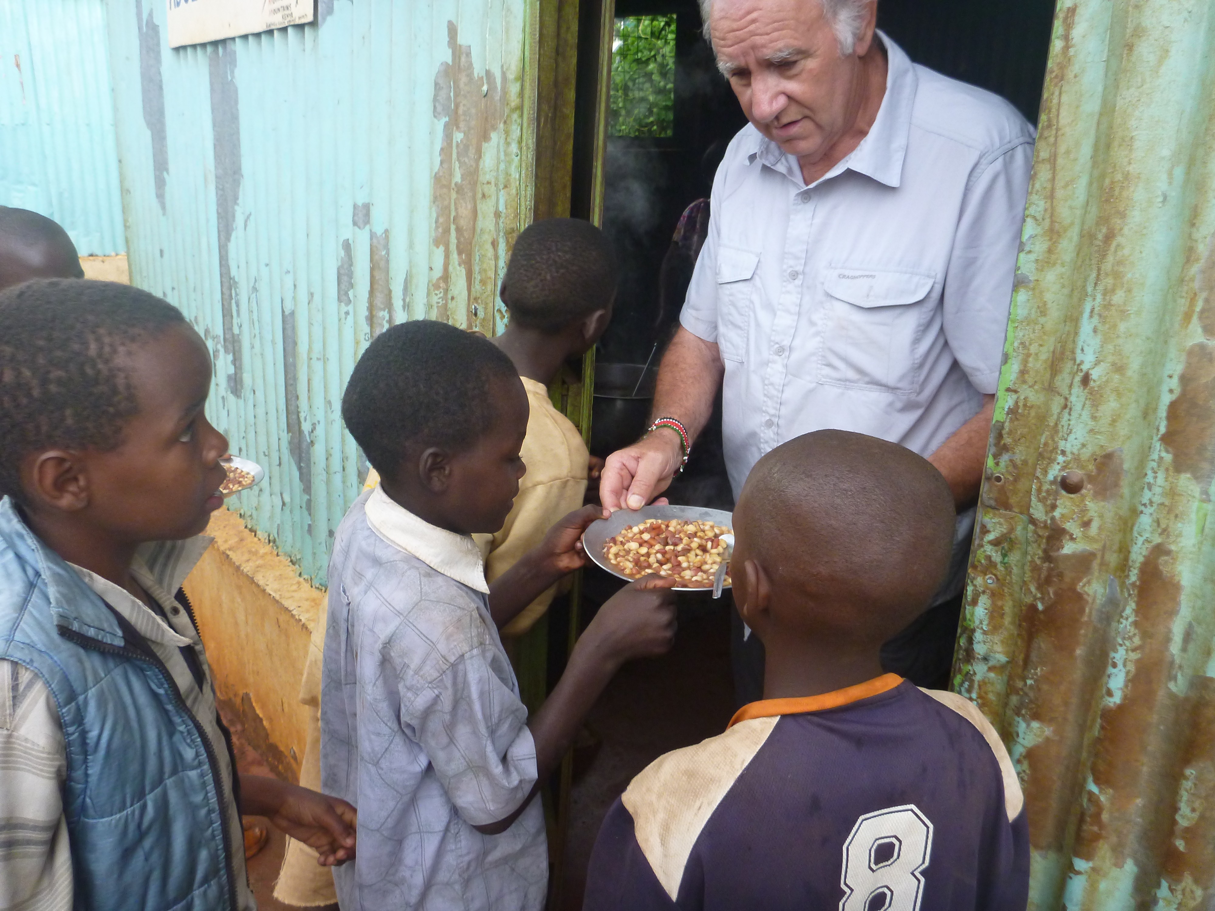 Roger handing out meals to the many Street Children